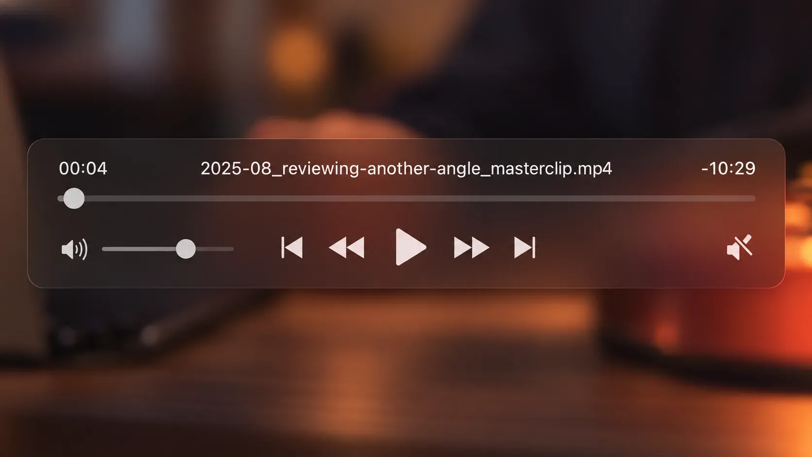 Translucent player controls over a blurred, warm video frame, showing the timecode 00:04, the clip filename and the remaining time