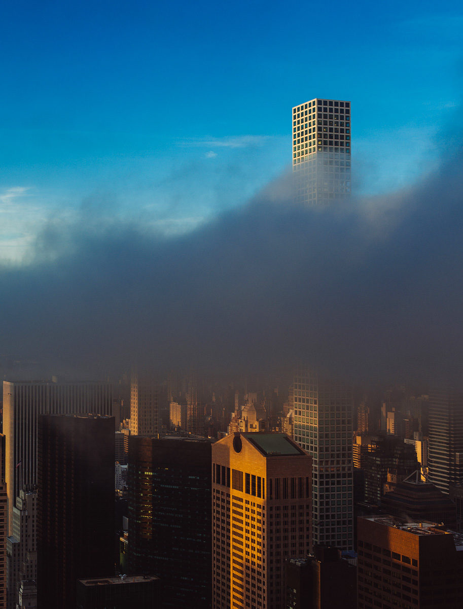 newyork-halfhalf-clouds-tower-skyscraper